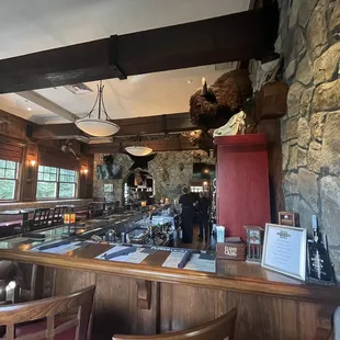 a bar with a stuffed bear on the wall