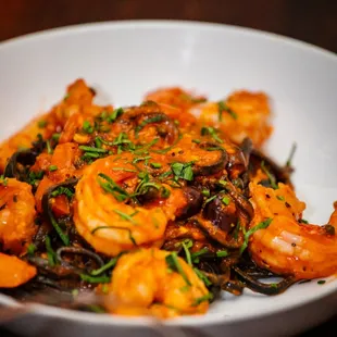 a bowl of shrimp and mushrooms