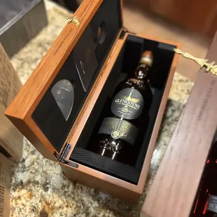 a bottle in a wooden case