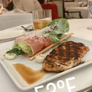 Caesar salad with an added blackened chicken breast Treviso Caesar Salad