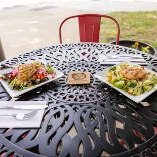 three plates of food on a table
