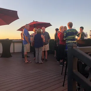 a group of people standing on a deck