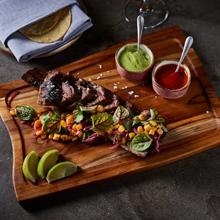 a wooden cutting board with a variety of food items