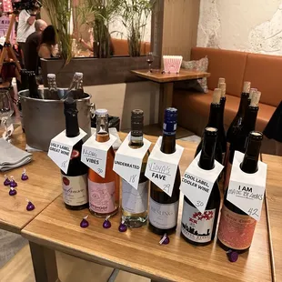 bottles of wine on a wooden table