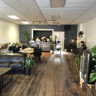 a coffee shop with a coffee table and couches