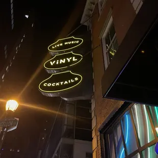 a neon sign on a building at night