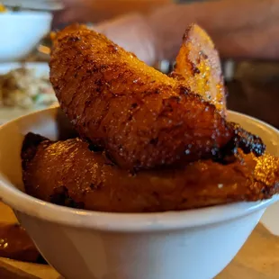 The fried platano on the menu which my culture we would call it platanos Maduro.