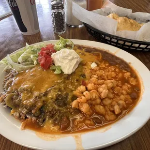 Blue corn enchiladas with chicken, posole, beans, sour cream