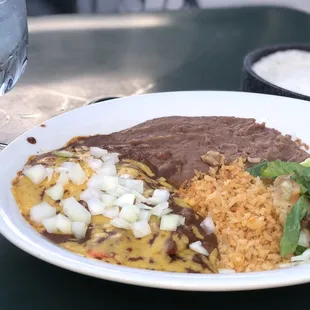 El Tradicional, 2 cheese enchiladas with a puffy taco.
