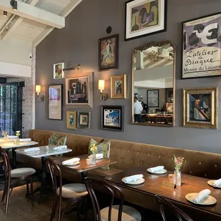 a dining area with tables and chairs