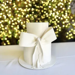 2 tiered wedding cake smooth finish with ivory bow