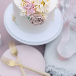 a white cake with flowers on top