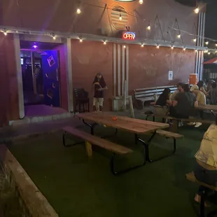 people sitting outside at night