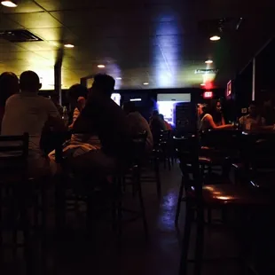 people sitting at a bar