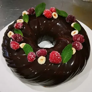 Indulge in Choco-Mint Bliss: rich chocolate cake, velvety mousse, &amp; fresh mint cream. Perfectly balanced for any holiday. Serves 8-10.