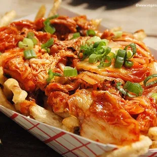Try our very own Kimchi Fries! French fries served with caramelized kimchi, cheese wiz, and fresh-cut scallion.