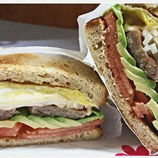 Breakfast sandwiches Available Now. Sausage, egg and cheese with Avocado, Tomato &amp; Onions.