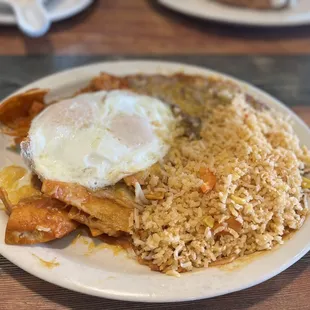 Chilaquiles with red sauce over easy egg YUM!