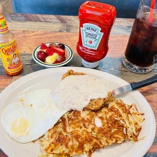 Breakfast Country Fried Steak w/ 2 eggs, hash browns, and fruit.