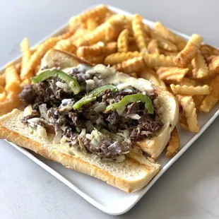 a steak sandwich and french fries