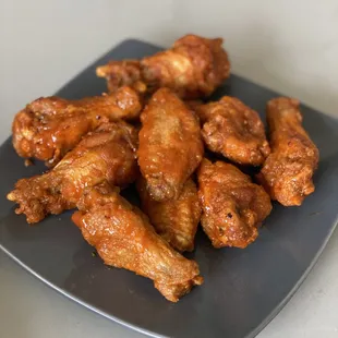 a plate of chicken wings