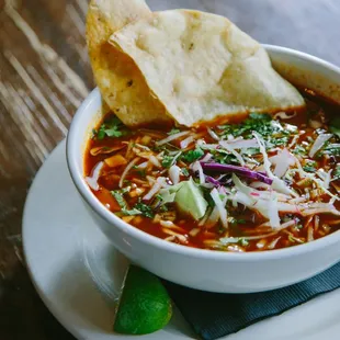 a bowl of chili and tortilla