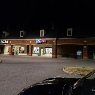 a car parked in front of it