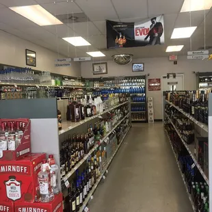 a wide aisle of liquor