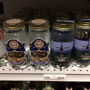 jars of liquor on a shelf