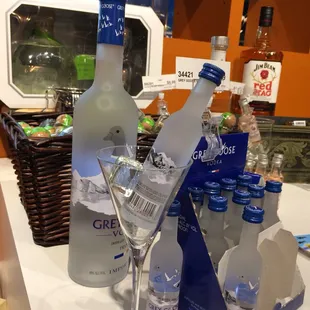 a glass of vodka and bottles of vodka