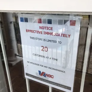 a notice sign in a window