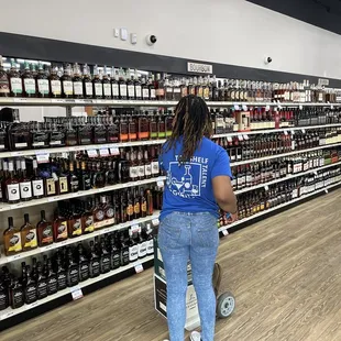 a woman shopping in a liquor store