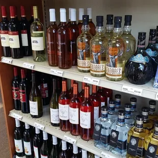 a shelf full of liquor bottles