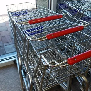 a row of shopping carts in a store