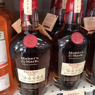 a shelf of bottles of liquor