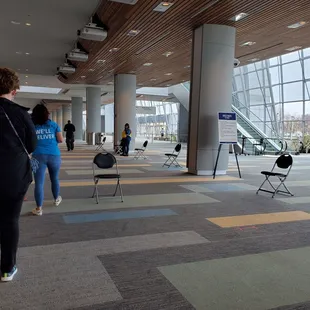 Happily waiting in line to receive the COVID vaccine.