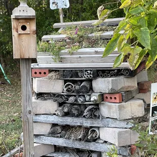 a birdhouse and a pile of junk