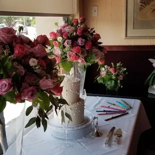The large arrangements on table were originally in front of the altar at the church.