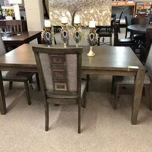 This dinette set comes with a center leaf to expand seating up to 10 people.