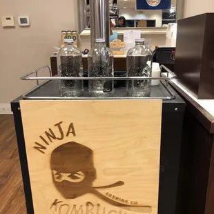 a wooden sign for a coffee shop