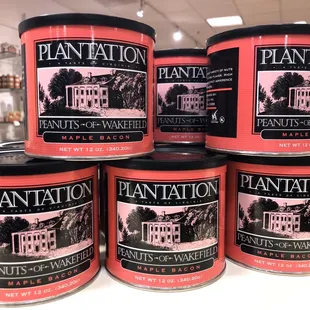 a stack of plantation tins