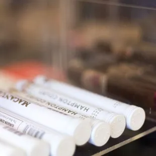 a display case with pens in it