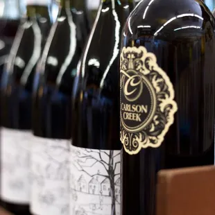 a row of bottles of wine