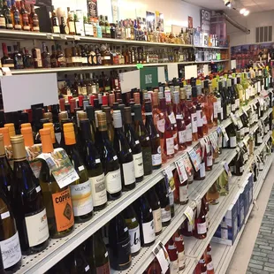 rows of wine bottles on shelves