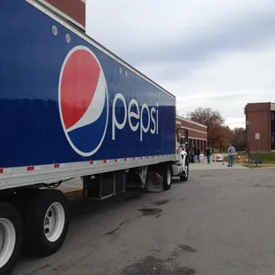 Foodbank day, Pepsi helping with tractor