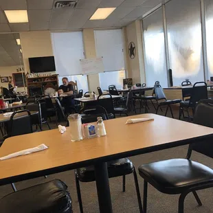 a dining room with tables and chairs
