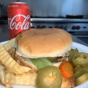 a plate of food and a soda