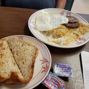 Over medium eggs, sausage, hash browns &amp; homemade wheat toast!
