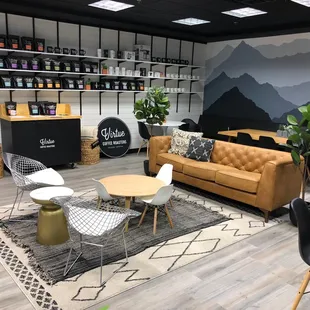 a coffee shop with a mountain mural on the wall
