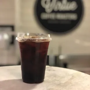 a cold beverage in a plastic cup